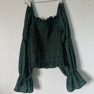 Off the shoulder black and green floral top with ruffles